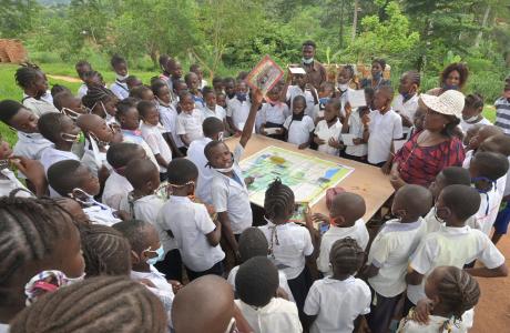 A class learning about environmental awareness in a school near the Luki MAB