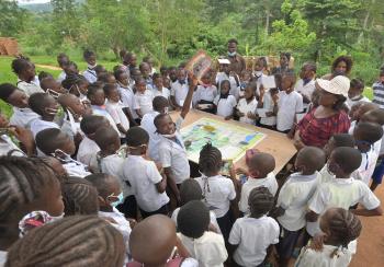 A class learning about environmental awareness in a school near the Luki MAB